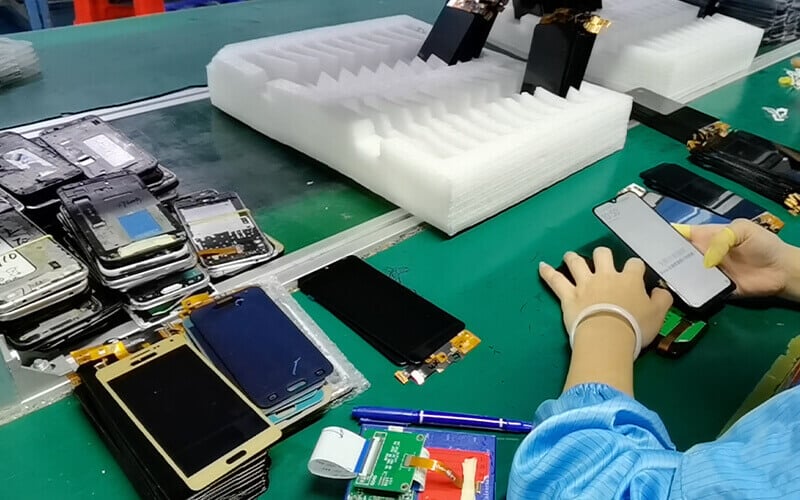 Phone screen manufacturers inspecting LCD quality for optimal performance