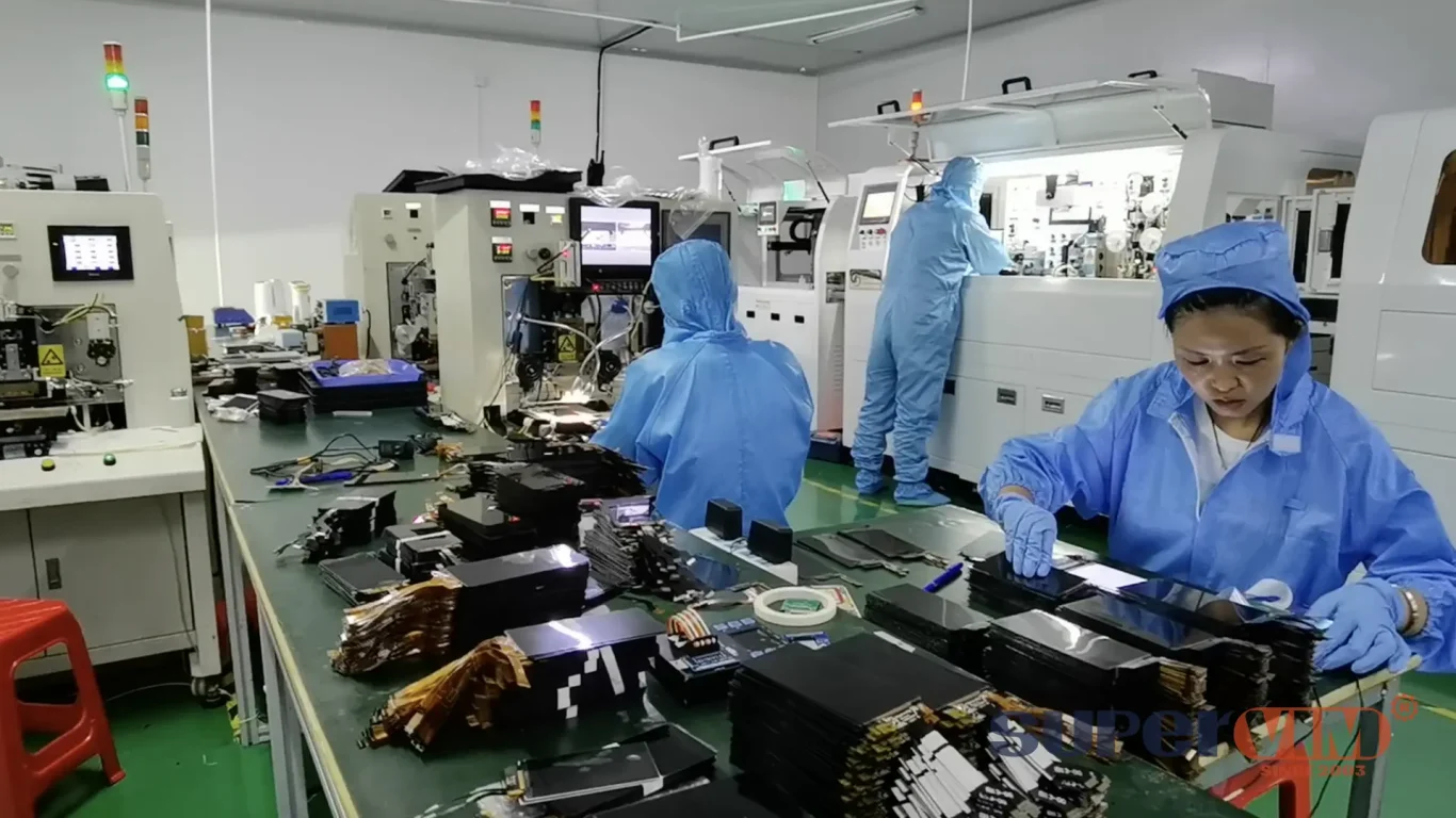 Factory workers assembling phone LCDs for wholesale